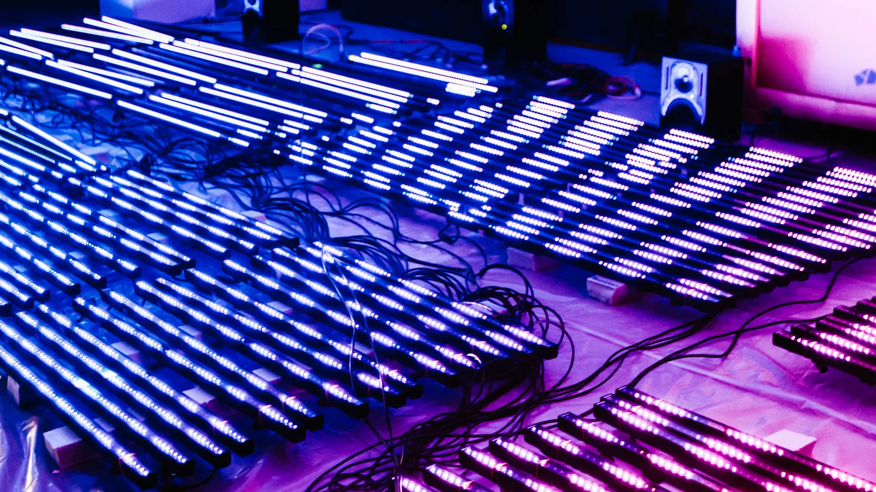 Illuminated LED panels laid out during the studio build